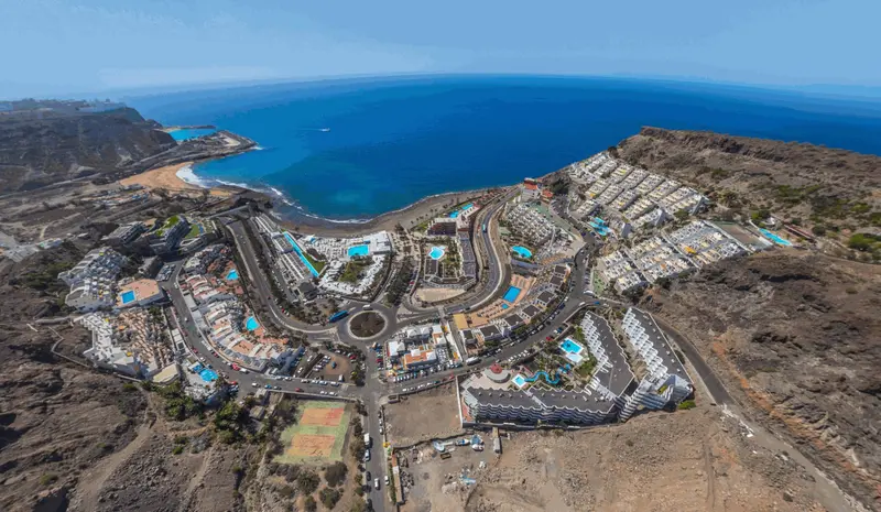 Aerial view of the complex and Playa del Cura bay