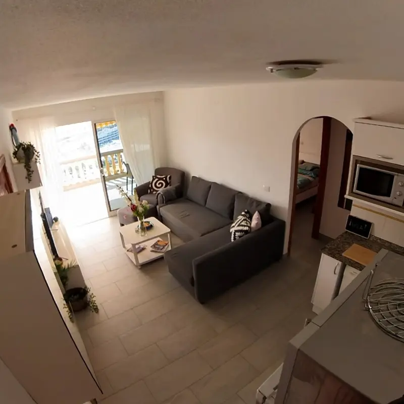 Living room with sofa and bedroom door